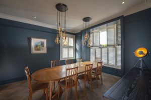 Open Dining Room Tier on Tier Box Bay Window Shutters Installed By The Great Shutter Co.