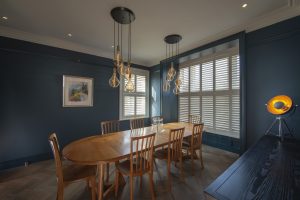 Dining Room Tier on Tier Box Bay Window Shutters Installed By The Great Shutter Co.